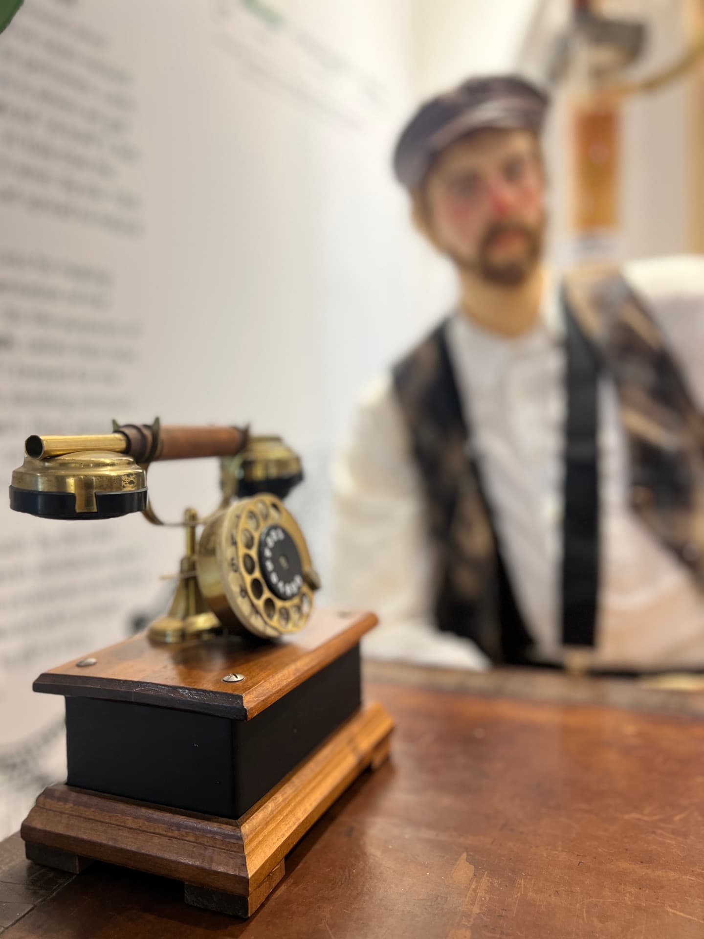 Vintage telephone and innkeeper mannequin in the exhibit